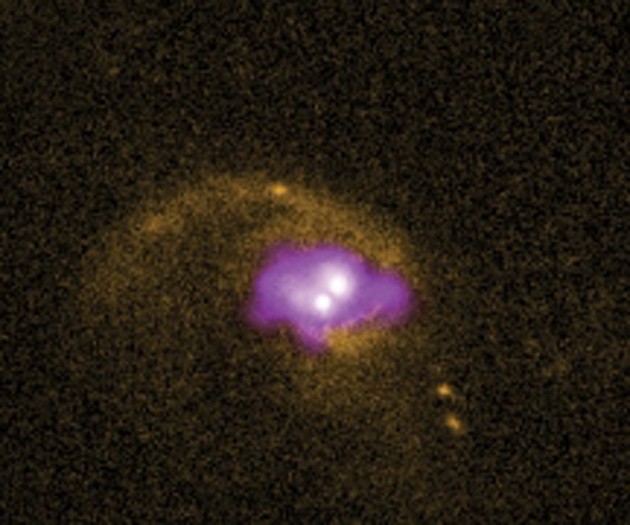 Image right: This photo of a distant galaxy combines visible light  from the Hubble Space Telescope (orange) with X-rays  from the Chandra X-ray Observatory (purple). The two bright spots at center may mark two black holes. The one at lower left may fly out of its galaxy and never return.  