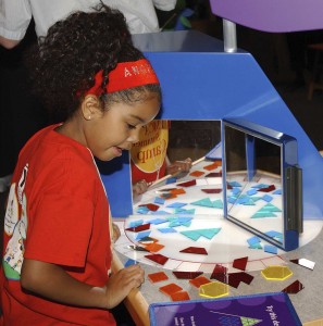 A child playing a puzzle game at the Lemelson Center