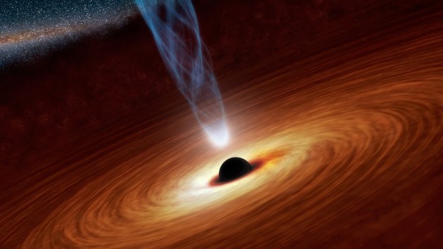 In this artist’s conception a supermassive black hole is surrounded by a hot accretion disk, while some in-spiraling material is funneled into a wispy blue jet. (Photo: NASA/JPL-Caltech)