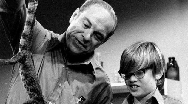 Don Herbert, with a young assistant, exhibiting an example of "Living Animal Fossils" on "Mr. Wizard" in 1971.