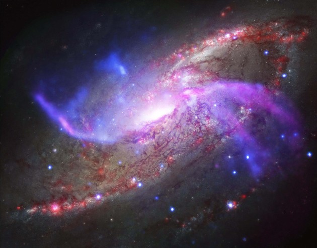 This galactic fireworks display is taking place in NGC 4258 (also known as M106), a spiral galaxy like the Milky Way. (Image credit: NASA/CXC/JPL-Caltech/STScI/NSF/NRAO/VLA)