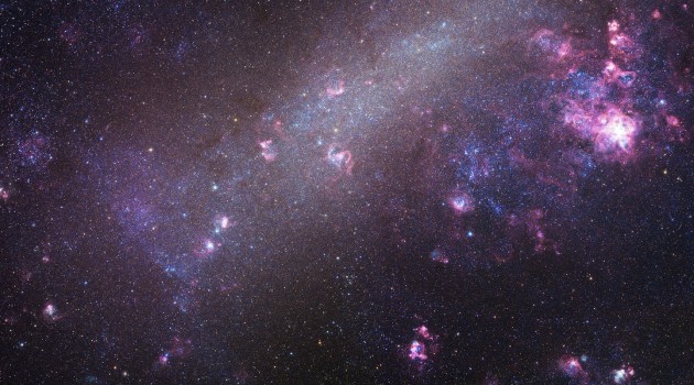 Astronomers have identified 18 extreme mass-ratio binaries in a neighboring galaxy called the Large Magellanic Cloud, pictured here. The more massive stars weigh 6 to 16 times as much as the Sun, while the less massive stars weigh about 1 to 2 times the Sun. We've caught them "in the delivery room," since one star is fully formed while the other is still in its infancy. These systems represent a new class of binary stars. (Image copyright Robert Gendler and Josch Hambsch 2005)