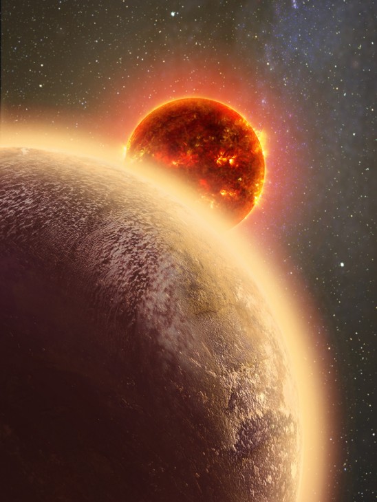 In this artist's conception GJ 1132b, a rocky exoplanet very similar to Earth in size and mass, circles a red dwarf star. GJ 1132b is relatively cool, about 450 degrees F, and could potentially host an atmosphere. At a distance of only 39 light-years, it will be a prime target for additional study with Hubble and future observatories like the Giant Magellan Telescope. (Image by Dana Berry)