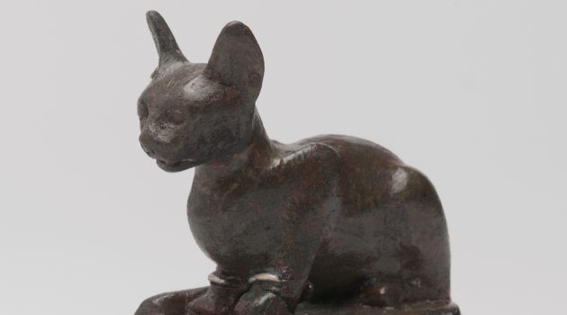 Bronze weight statuette representing a recumbent cat upon a high base,  
305-30 B.C., bronze, silver, lead
(Image courtesy Brooklyn Museum)