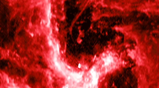 A radio image from the NSF’s Karl G. Jansky Very Large Array showing the center of our galaxy. The mysterious radio filament is the curved line located near the center of the image, & the supermassive black hole Sagittarius A* (Sgr A*), is shown by the bright source near the bottom of the image. (NSF/VLA/UCLA/M. Morris et al.)